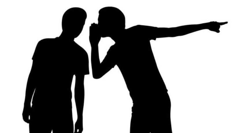 silhouette of a man whispering in another mans ear