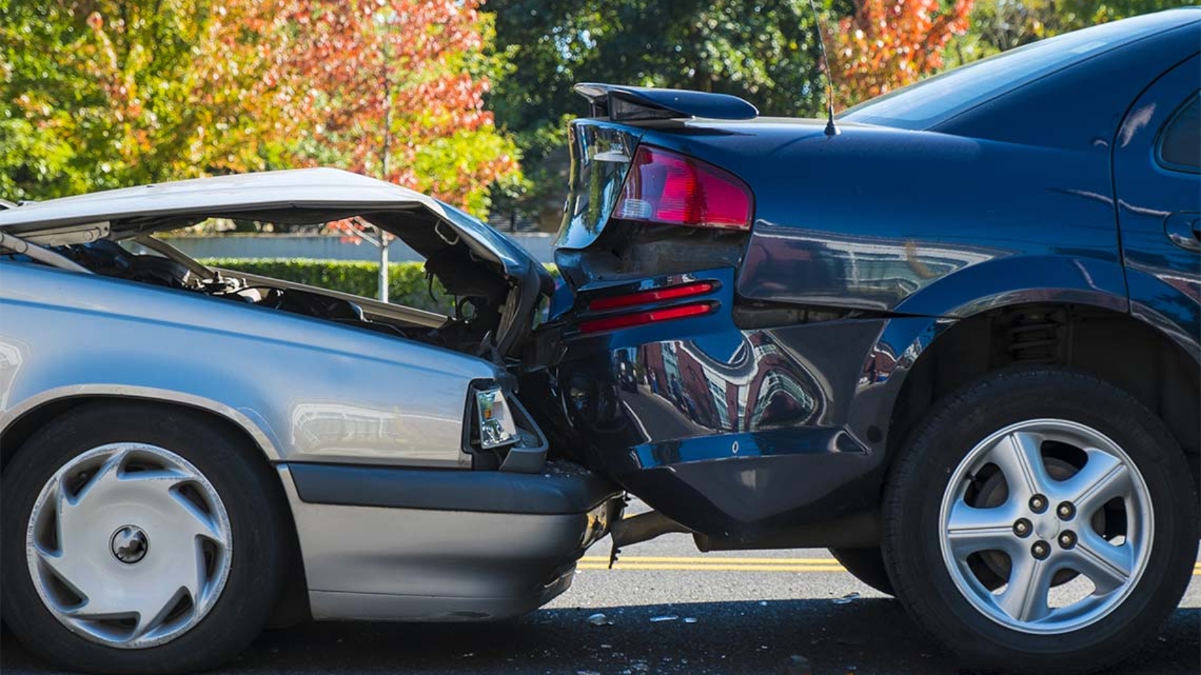 Auto accident involving two cars on a city street